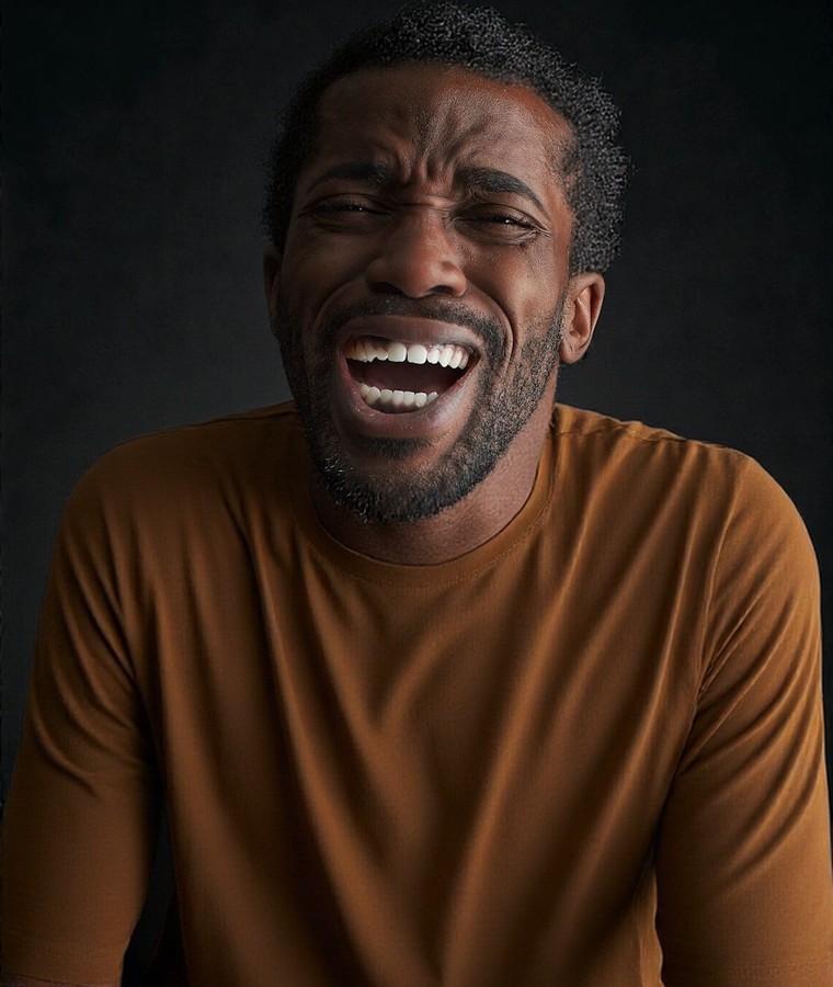 A chocolate brown long sleeve top on a deep-skinned model, blending into the skin tone.